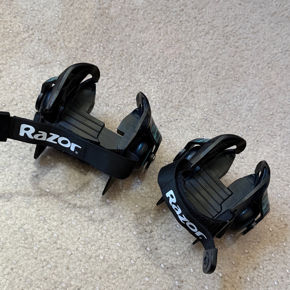 Razor Black Heel Skates with White Logo Straps